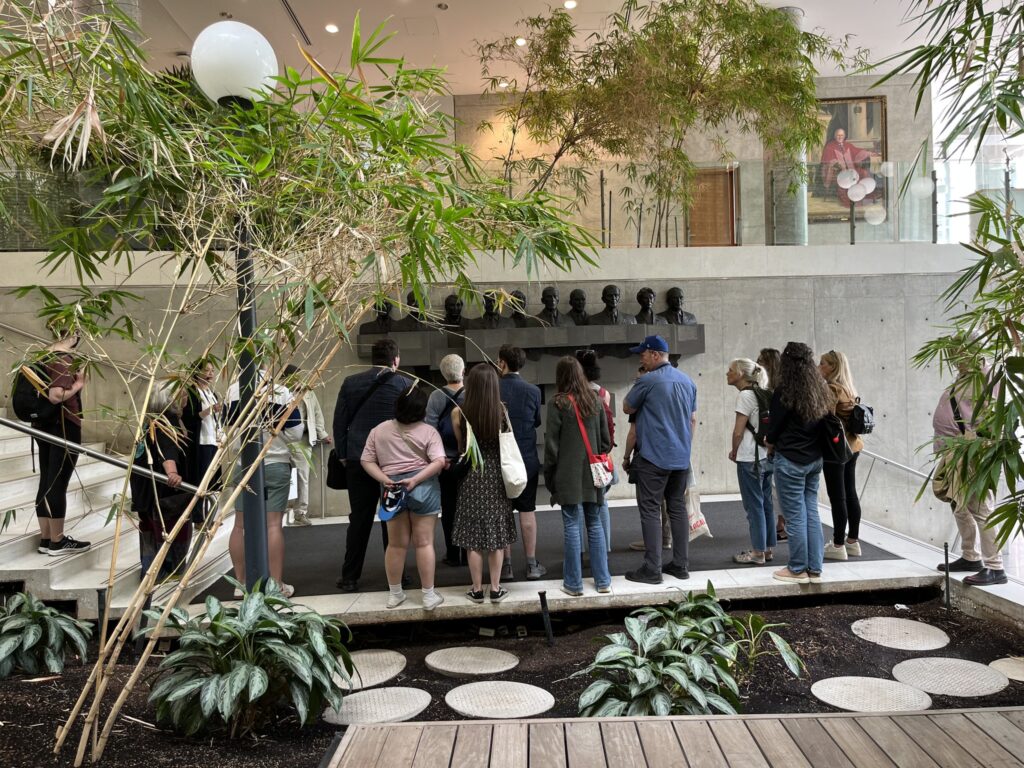 Walking tour at Donnelly Building, "Shoulders of Giants" sculpture